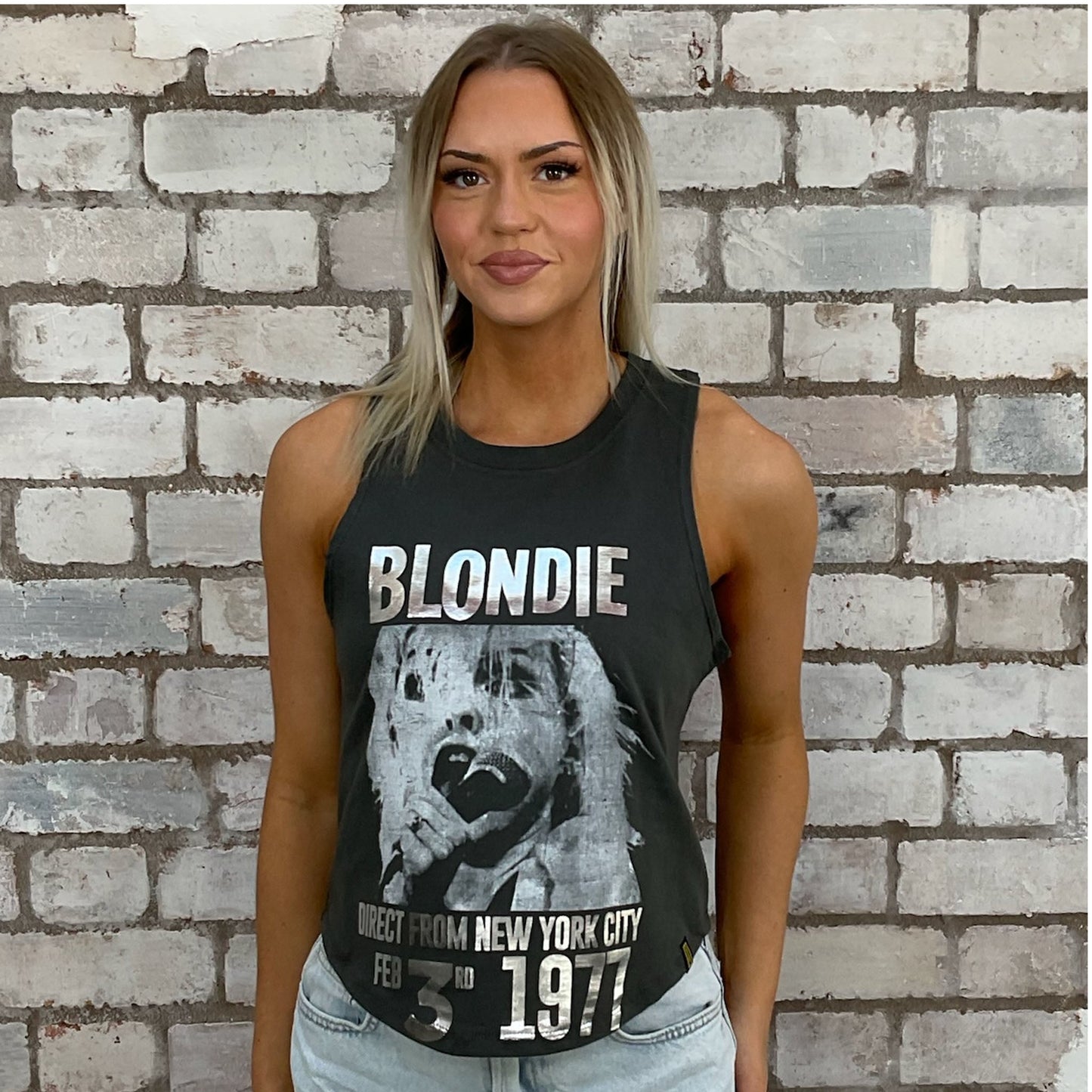 Blondie Graphic tshirt recycled into sleeveless racerback vest top, sustainable upcycled fashion, British recycled grunge brand, slow fashion, Punk Rock music style graphic tshirt upcycled by Unwantees, upcycled in the UK by unwantees. Sustainable upcycled fashion. Blondie Graphic tshirt upcycled by Unwantees recycled tshirt otherwise destined for landfill.