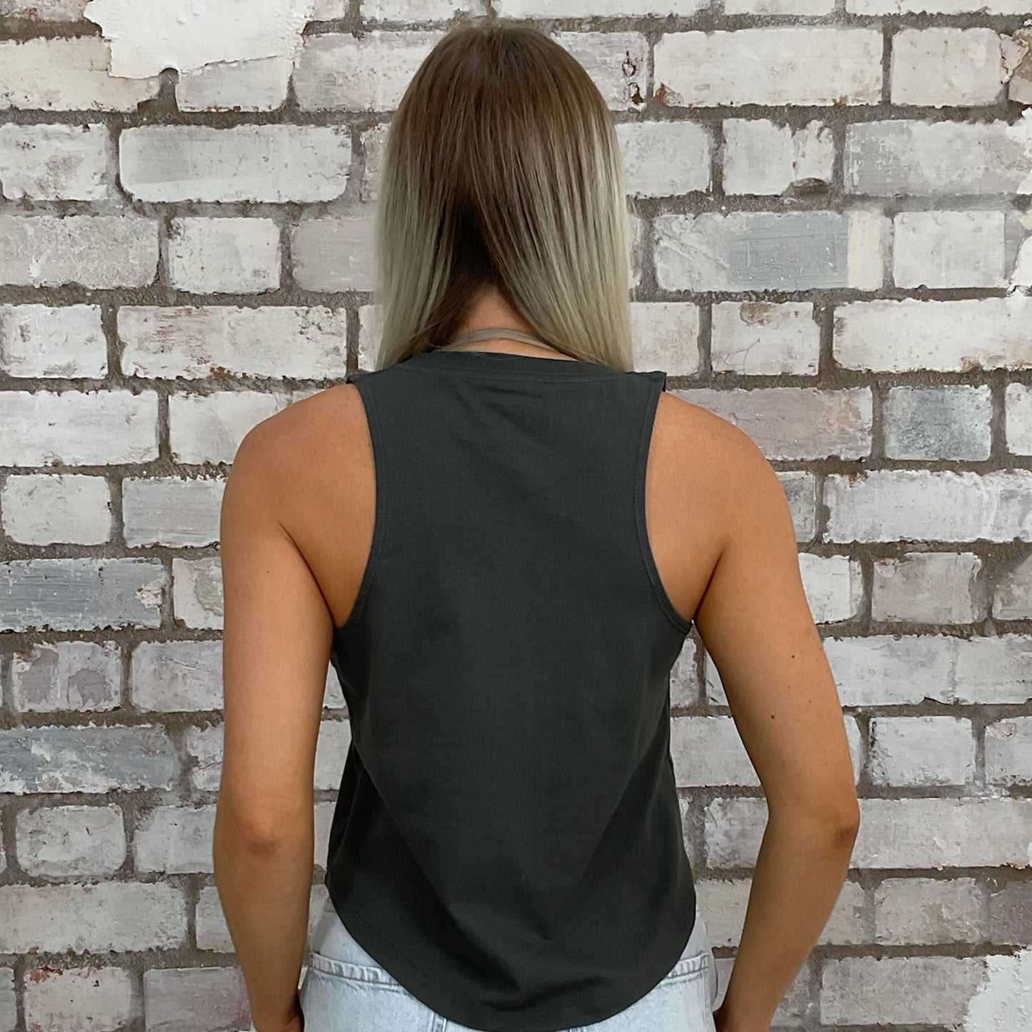 Graphic Blondie band tshirt recycled into sleeveless racerback vest top, sustainable upcycled fashion, British recycled grunge brand, slow fashion, Punk Rock music style graphic tshirt upcycled by Unwantees, upcycled in the UK by unwantees. Sustainable upcycled fashion. Blondie Graphic tshirt upcycled by Unwantees recycled tshirt otherwise destined for landfill.