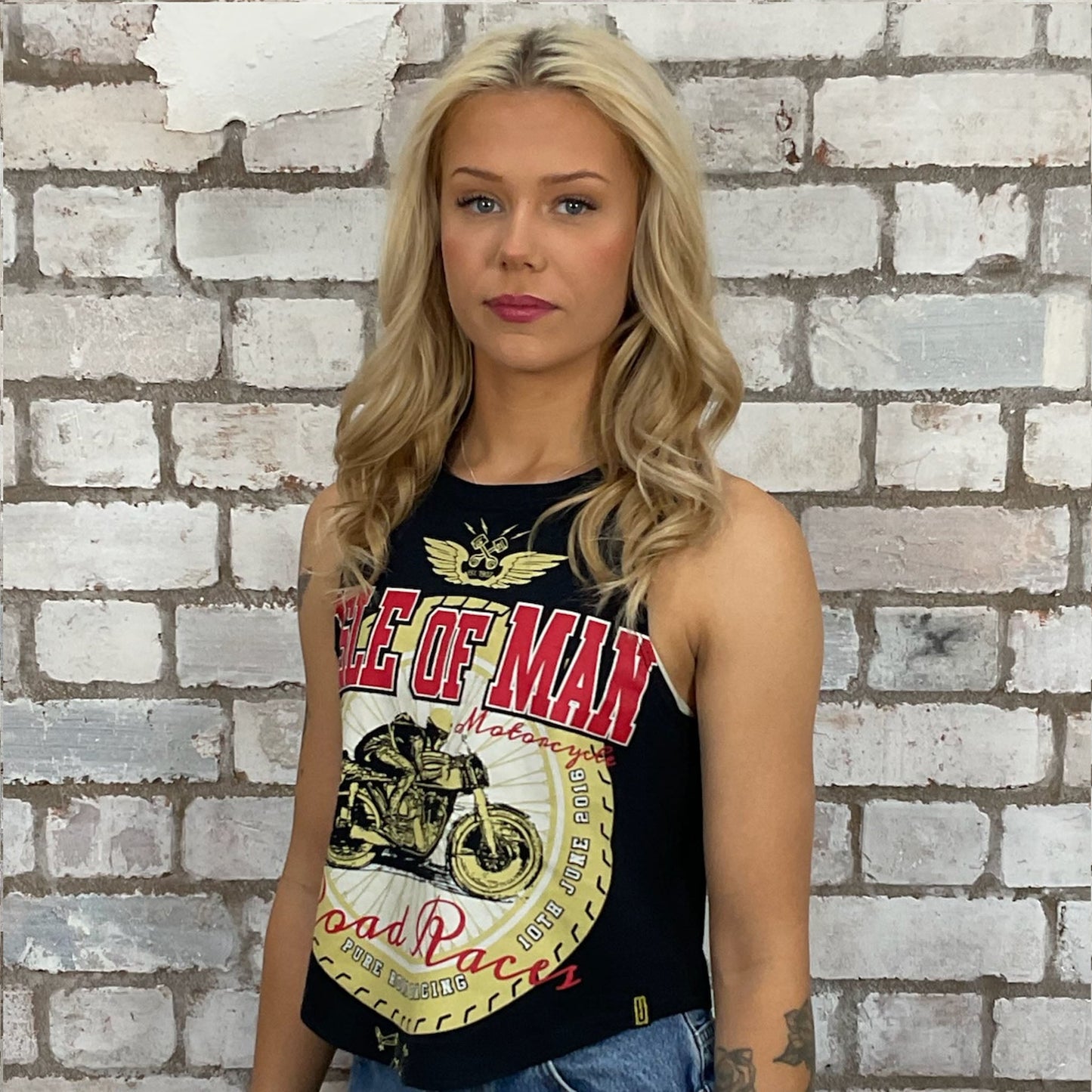 Road Racing, Isle of Man 2018 tshirt recycled into sleeveless Slash Neck vest top, sustainable upcycled fashion, British recycled grunge brand, slow fashion, Punk Rock music style graphic tshirt upcycled by Unwantees, tshirt upcycled in the UK by unwantees. Sustainable upcycled fashion. Graphic tshirt upcycled by Unwantees recycled tshirt otherwise destined for landfill.