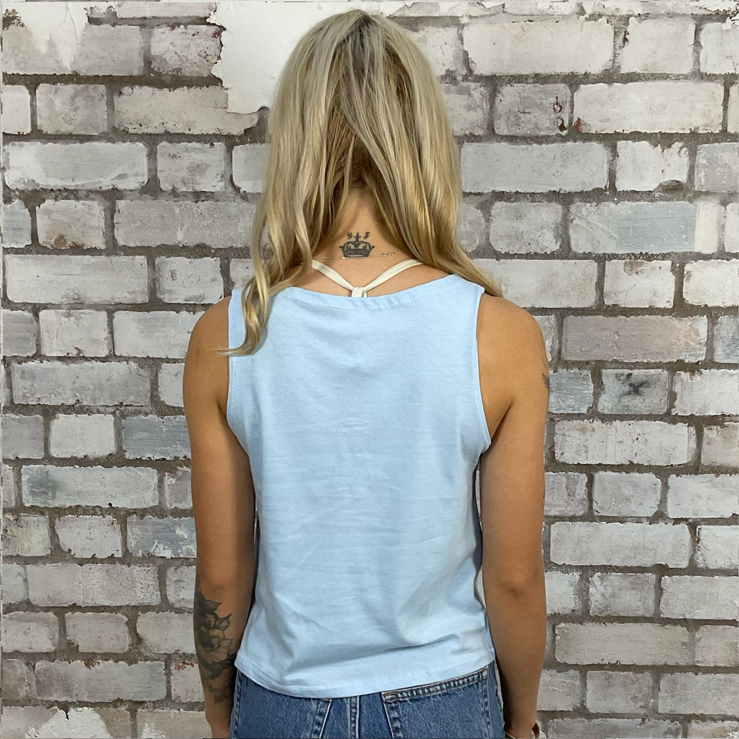 Nevermind Album Cover by Nirvana, Graphic Print tshirt recycled into sleeveless vest top, sustainable upcycled fashion, British recycled fashion brand, slow fashion, eco conscious fashion graphic tshirt upcycled by Unwantees, recycled tshirt otherwise destined for landfill. Rock music style graphic tshirt upcycled by Unwantees, Slash Neck tank top, upcycled in the UK by unwantees. Sustainable upcycled fashion