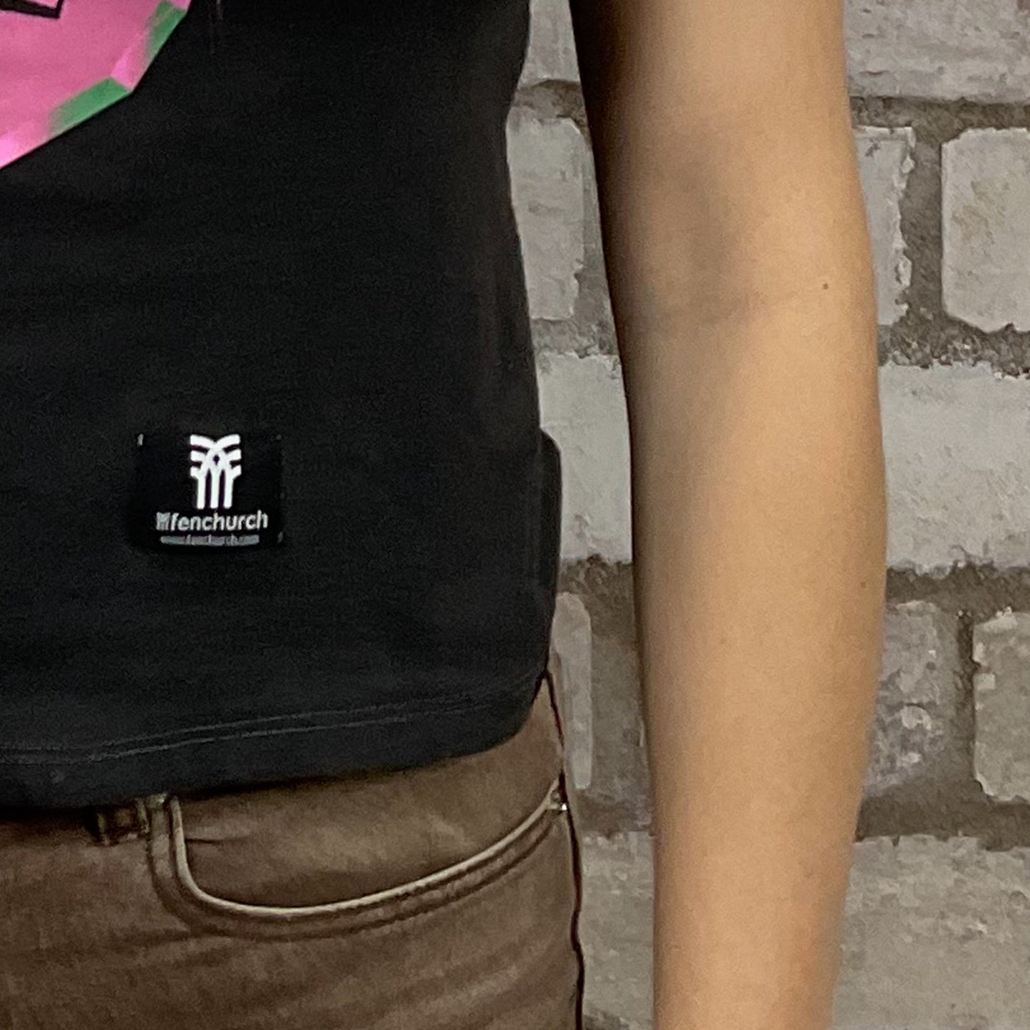 Hackney Diamonds, The Rolling Stones, electric pink Graphic print on 100% black cotton fabric, Festival Style Unwantee made from upcycled and deconstructed graphic tshirt, punk rock style street wear, athleisure wear, unwantees is a sustainable fashion brand, we take unwanted graphic tshirts otherwise destined for landfill and recycle clothing into vest tops for sports wear or leisure. Refashioned band merch, Slash Neck Sleeveless Top