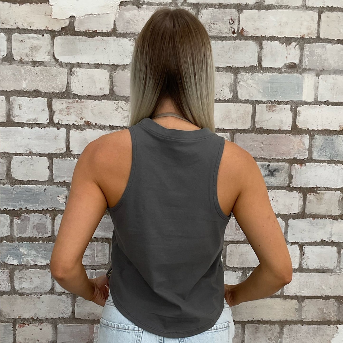Savage graphic print tshirt recycled into sleeveless vest top, sustainable upcycled fashion, British recycled fashion brand, slow fashion, eco conscious band graphic tshirt upcycled by Unwantees, recycled tshirt otherwise destined for landfill. Rock music style graphic tshirt upcycled by Unwantees, Grey Racerback tank top, upcycled in the UK by unwantees. Sustainable upcycled fashion