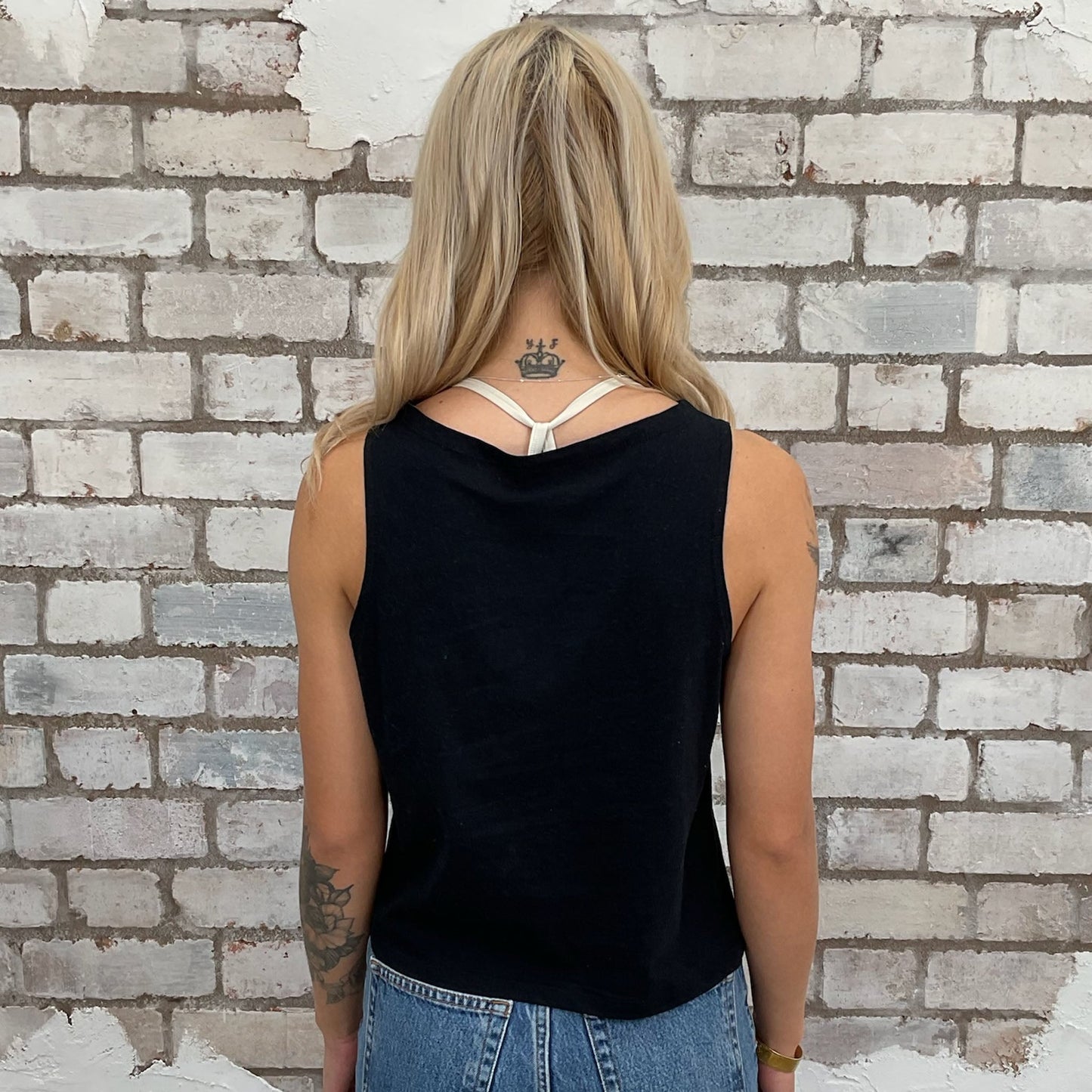 Metallica print grey tshirt recycled into sleeveless vest top, sustainable upcycled fashion, British recycled fashion brand Social Recluse Hundred club, slow fashion, eco conscious band graphic tshirt upcycled by Unwantees, recycled tshirt otherwise destined for landfill. Rock music style graphic tshirt upcycled by Unwantees, Grey Racerback tank top, upcycled in the UK by unwantees. Sustainable upcycled fashion