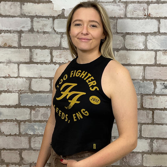 The Foo Fighters, Leeds, 2012 Tour Tshirt Upcycled by Unwantees, Graphic yellow print on black Tshirt jersey fabric, Festival Style Unwantee made from upcycled and deconstructed graphic tshirt, athleisure wear, unwantees is a sustainable fashion brand, we take unwanted graphic tshirts otherwise destined for landfill and recycle clothing into vest tops for sports wear or leisure. Refashioned band merch, Slash Neck Sleeveless Top