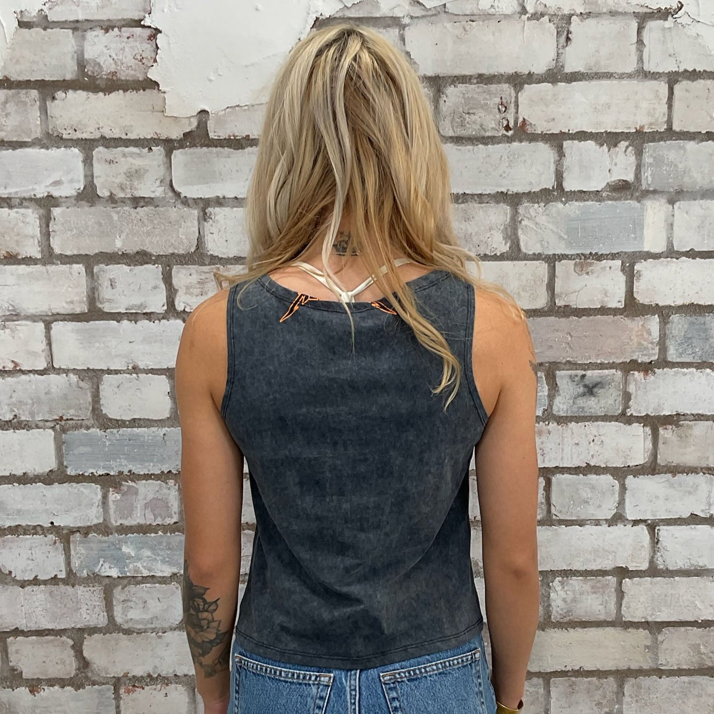 Upcycled Metallica band tshirt now a vest top, upcycled in the UK by unwantees. Sustainable fashion brand Unwantees recycled band tshirts otherwise destined for landfill. Sustainable upcycled fashion, punk and rock Music Style, sleeveless tank top, sustainable upcycled fashion, British recycled fashion brand