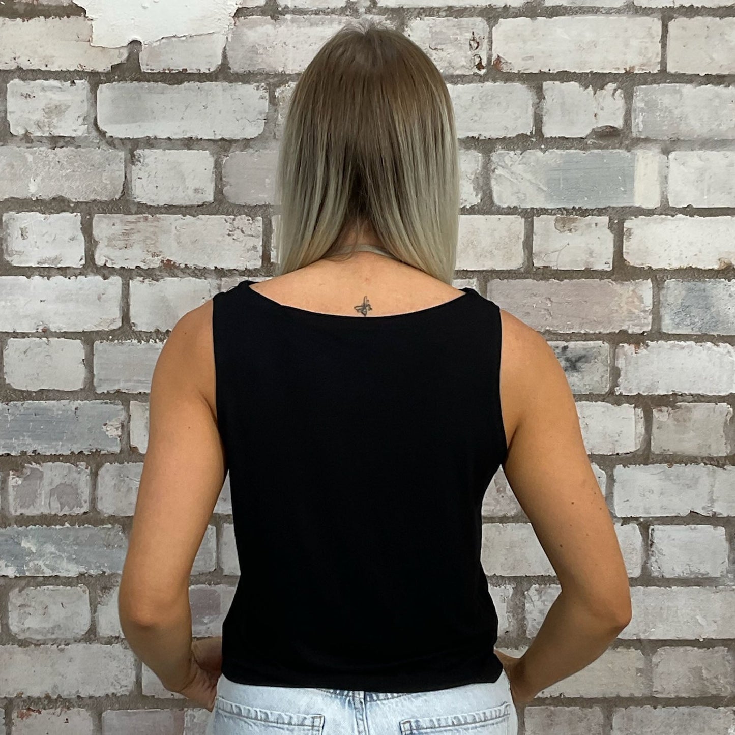 KISS Rock Band tshirt upcycled into sleeveless vest top, sustainable upcycled fashion, British recycled fashion brand, slow fashion, eco conscious fashion graphic tshirt upcycled by Unwantees, recycled tshirt otherwise destined for landfill. Punk Rock music style graphic tshirt upcycled by Unwantees, Slash Neck tank top, upcycled in the UK by unwantees. Sustainable upcycled fashion