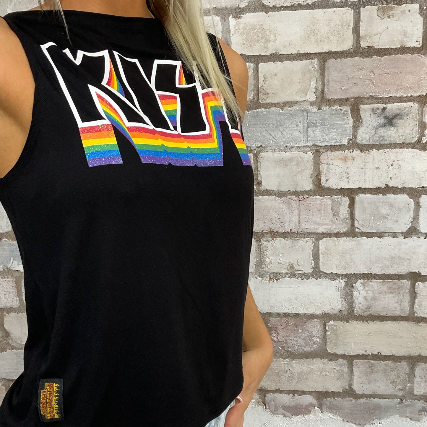 KISS Band tshirt recycled into sleeveless vest top, sustainable upcycled fashion, British recycled fashion brand, slow fashion, eco conscious fashion graphic tshirt upcycled by Unwantees, recycled tshirt otherwise destined for landfill. Punk Rock music style graphic tshirt upcycled by Unwantees, Slash Neck tank top, upcycled in the UK by unwantees. Sustainable upcycled fashion