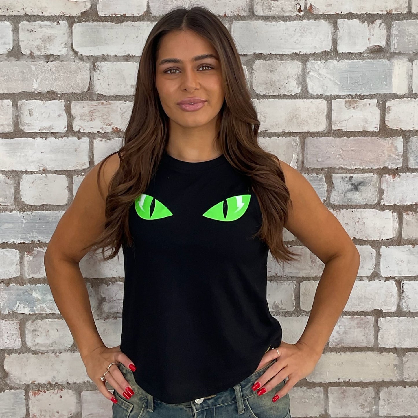 Halloween eco conscious fashion graphic cats eyes graphic tshirt upcycled by Unwantees recycled tshirt otherwise destined for landfill. Cats Eyes Graphic tshirt recycled into sleeveless vest top, sustainable upcycled fashion, British recycled grunge brand, slow fashion, Punk Rock music style graphic tshirt upcycled by Unwantees, Racerback tank top, upcycled in the UK by unwantees. Sustainable upcycled fashion