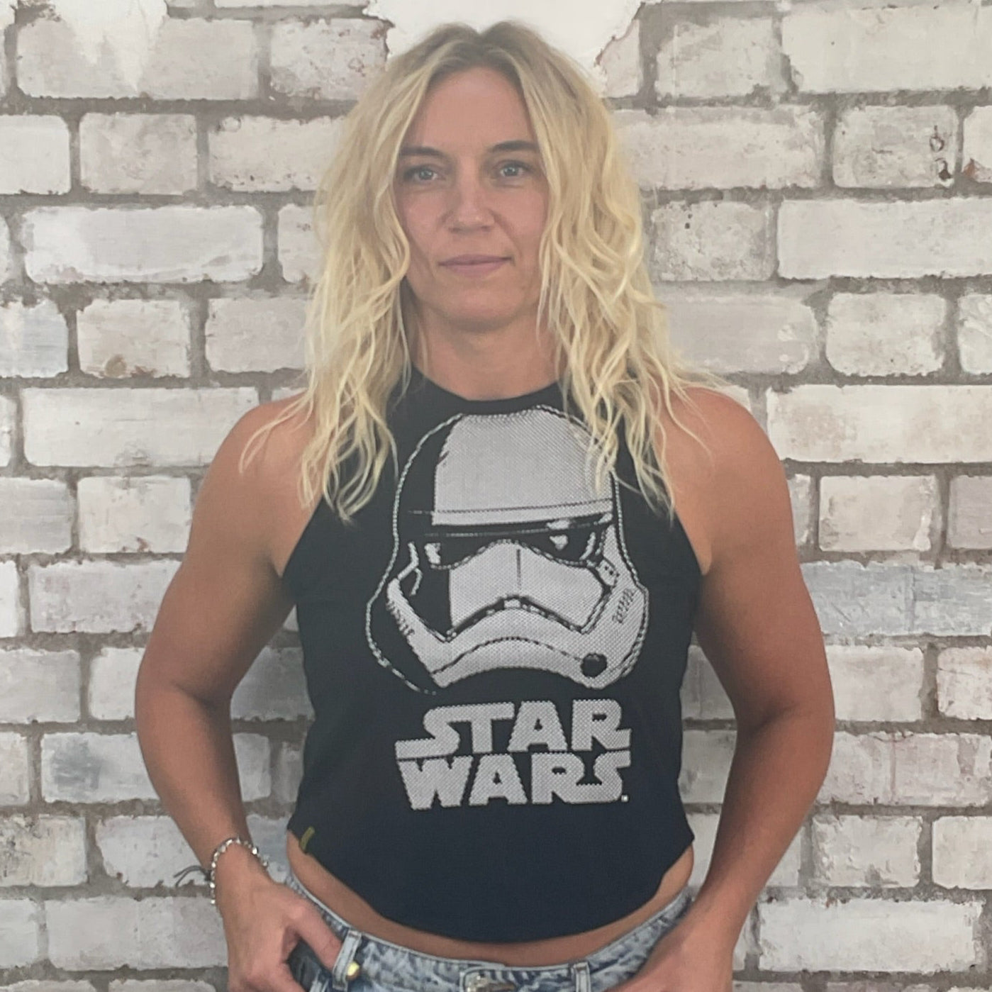 Person wearing a Star Wars tank top in front of a brick wall,
sustainable fashion UK
eco-friendly clothing UK
upcycled t-shirts / upcycled tank tops
ethical fashion brand UK
zero waste clothing
slow fashion brand
made in Britain clothing
sustainable vest tops