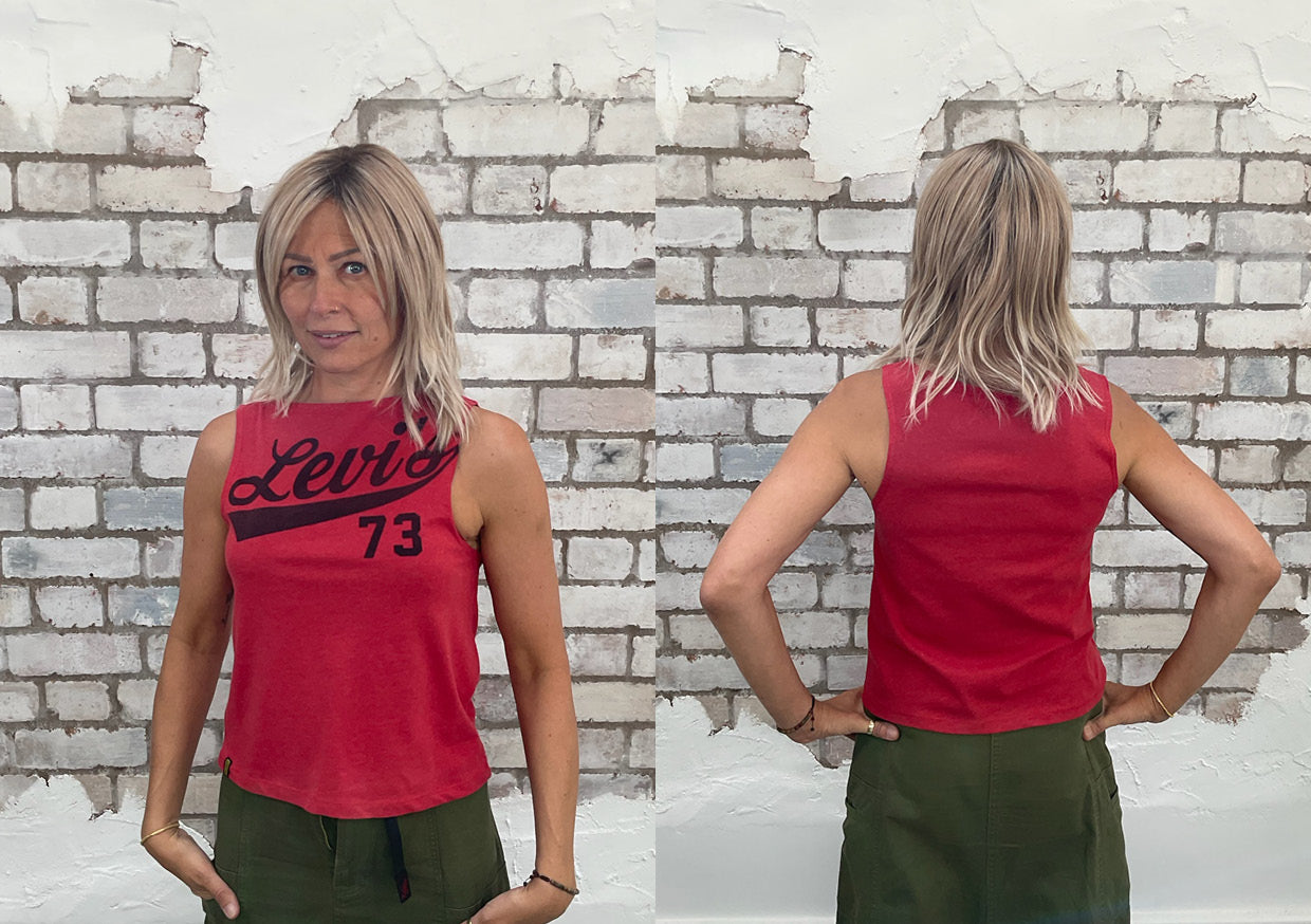 Red Levi's 73 Slashneck Unwantees top, front and back view on a woman, standing against a white brick wall for fit guide