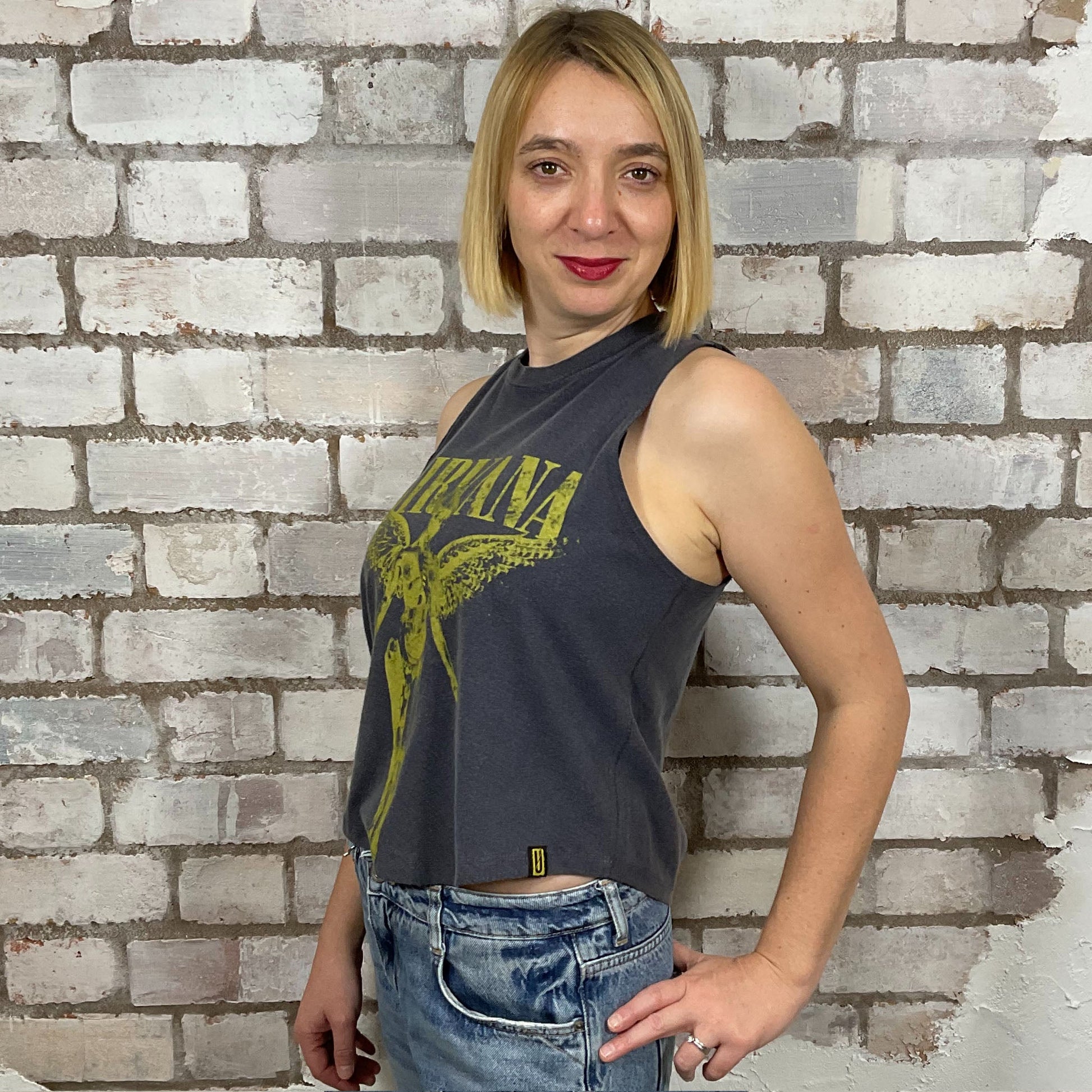 In Utero, Racerback tank in yellow Classic Nirvana graphic on faded grey T-shirt, top made from upcycled graphic band tshirt, punk rock style street wear, athleisure wear, unwantees is a sustainable fashion brand, we take unwanted graphic tshirts otherwise destined for landfill and recycle clothing into vest tops for sports wear or leisure.  Refashioned band merch, Slash Neck Sleeveless Top