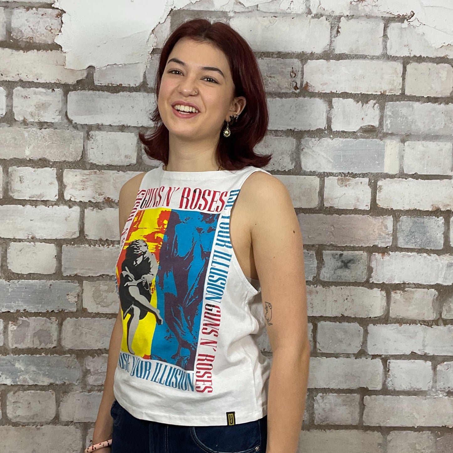 Use your Illusion Guns’N’Roses colourful graphic print on white 100% cotton fabric, Unwantee made from upcycled and deconstructed graphic tshirt, punk rock style street wear, athleisure wear, unwantees is a sustainable fashion brand, we take unwanted graphic tshirts otherwise destined for landfill and recycle clothing into vest tops for sports wear or leisure.  Refashioned band merch, Slash Neck Sleeveless Top