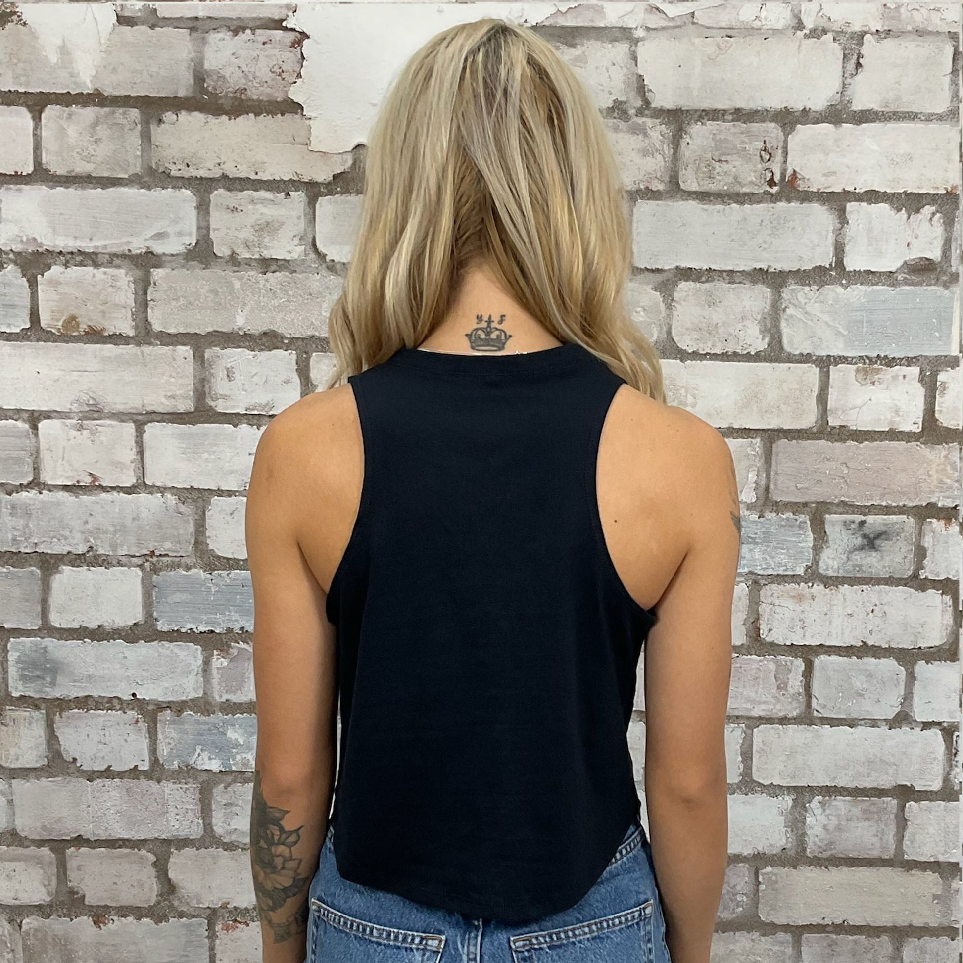2018 Isle of Man Road Racing tshirt recycled into sleeveless Slash Neck vest top, sustainable upcycled fashion, British recycled grunge brand, slow fashion, Punk Rock music style graphic tshirt upcycled by Unwantees, tshirt upcycled in the UK by unwantees. Sustainable upcycled fashion. Graphic tshirt upcycled by Unwantees recycled tshirt otherwise destined for landfill.