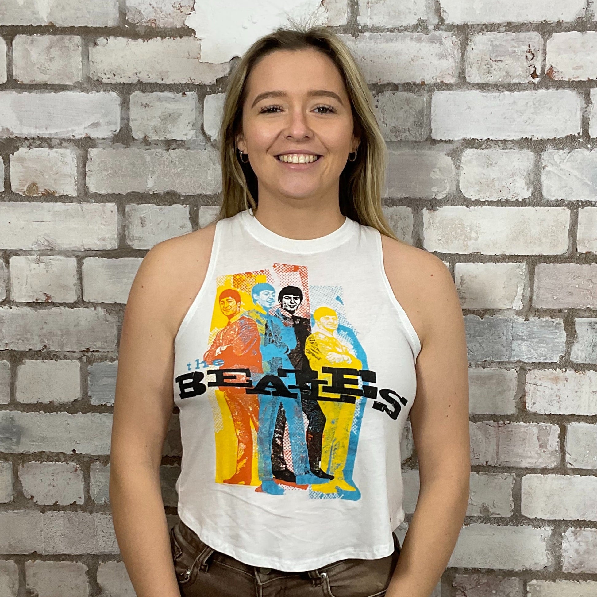 The Beatles Vibrant Colourful graphic band print on 100% white cotton fabric, Unwantee made from upcycled and deconstructed graphic tshirt, punk rock style street wear, athleisure wear, unwantees is a sustainable fashion brand, we take unwanted graphic tshirts otherwise destined for landfill and recycle clothing into vest tops for sports wear or leisure.  Refashioned band merch, Slash Neck Sleeveless Top