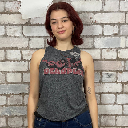 Person wearing a 'Deadpool' tank top against a brick wall.  Dark Grey marl Deadpool Smell you Later Racerback tank top, unwantees, vest top
