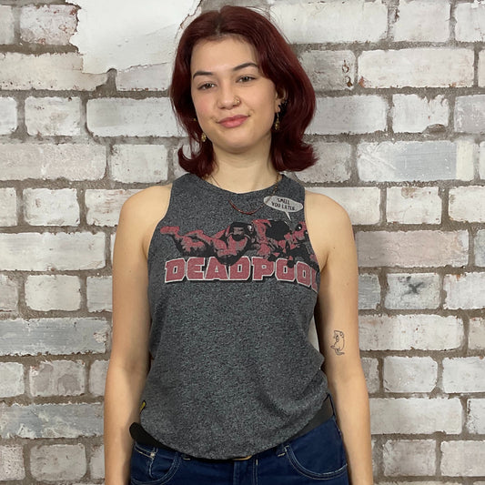 Person wearing a 'Deadpool' tank top against a brick wall.  Dark Grey marl Deadpool Smell you Later Racerback tank top, unwantees, vest top