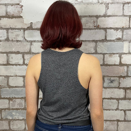 Person wearing a gray tank top against a brick wall.  Dark Grey marl Deadpool Smell you Later Racerback tank top, unwantees, vest top