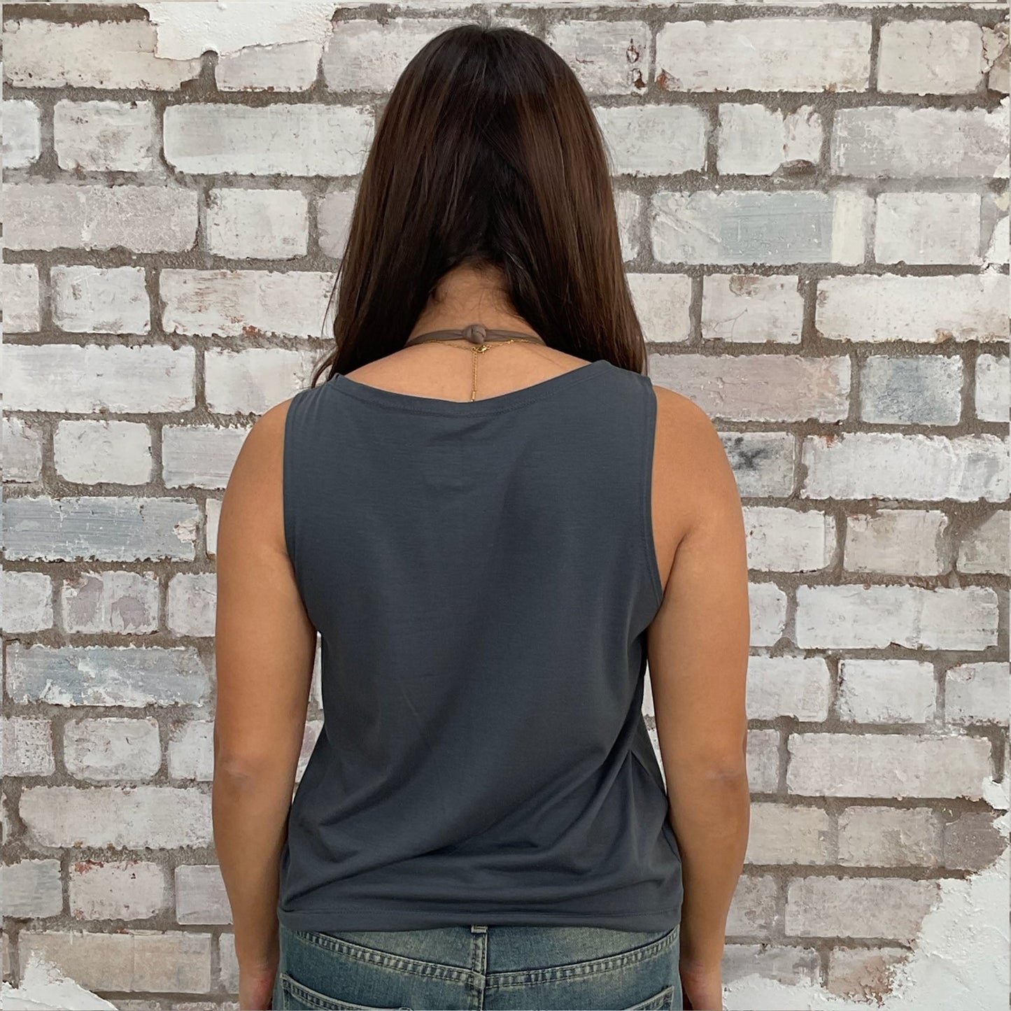 Upcycled graphic tshirt now a vest top, made in the UK by unwantees. Tiger print with Stay True Wild & Free graphics, Sustainable fashion brand Unwantees recycled vintage tshirts otherwise destined for landfill.  Sustainable upcycled fashion, Rock Music Style, sleeveless tank top, sustainable upcycled fashion, British recycled fashion brand