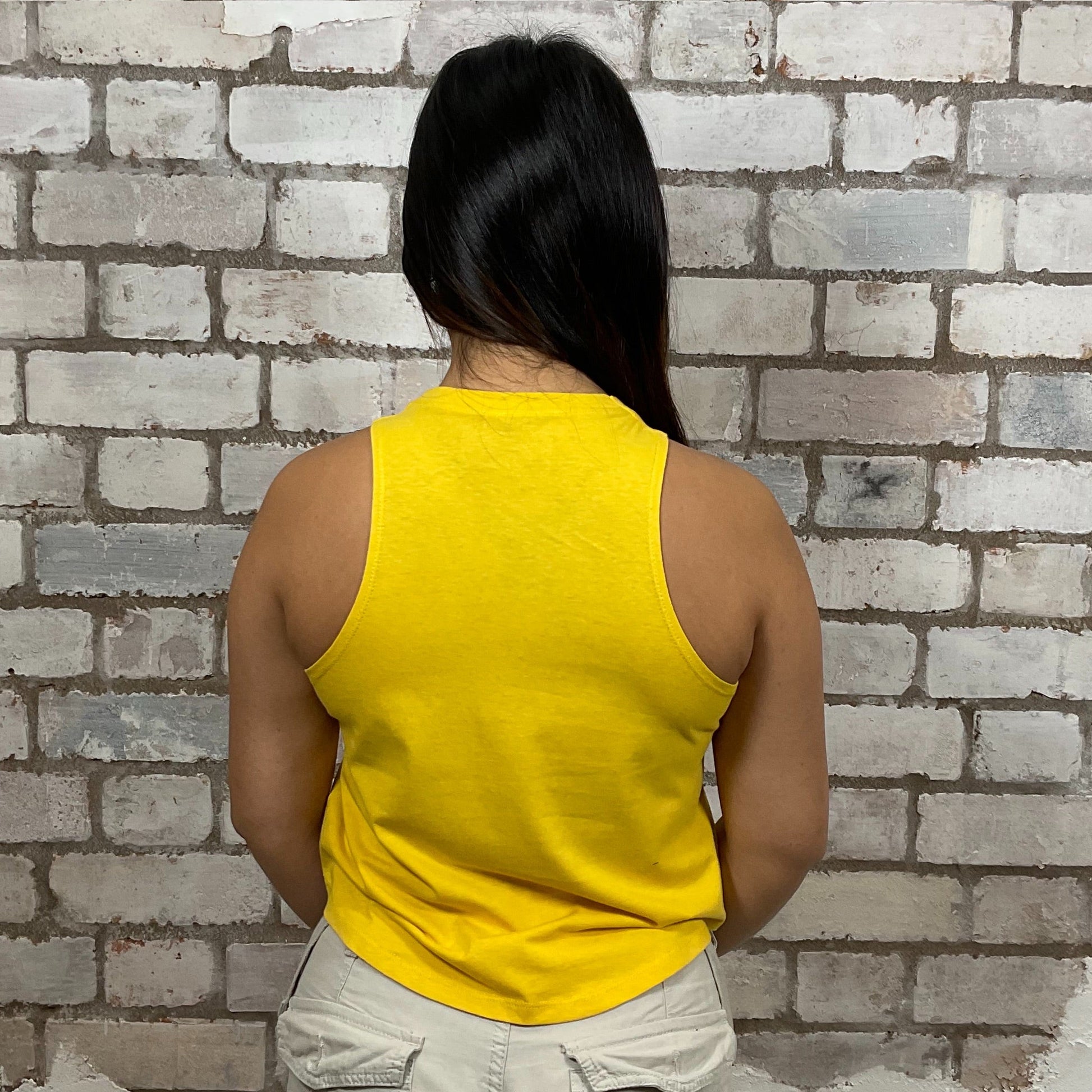 Genuine Rider vintage motorcycle graphic print on 100% golden yellow cotton fabric, Unwantee made from upcycled and deconstructed graphic tshirt, punk rock style street wear, athleisure wear, unwantees is a sustainable fashion brand, we take unwanted graphic tshirts otherwise destined for landfill and recycle clothing into vest tops for sports wear or leisure.  Refashioned band merch, Slash Neck Sleeveless Top
