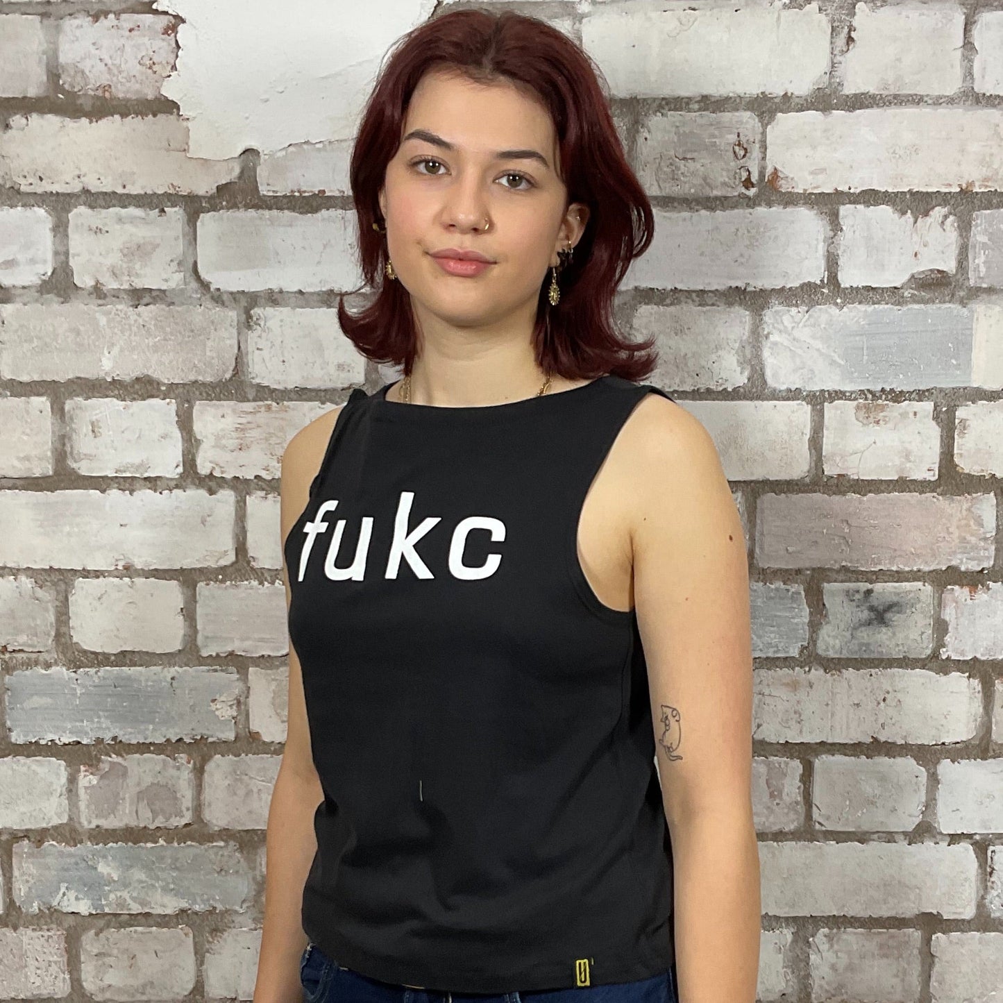 Fukc Kaiser Chiefs Band Double Sided printed Graphic on 100% black cotton fabric, Unwantee made from upcycled and deconstructed graphic tshirt, punk rock style street wear, athleisure wear, unwantees is a sustainable fashion brand, we take unwanted graphic tshirts otherwise destined for landfill and recycle clothing into vest tops for sports wear or leisure.  Refashioned band merch, Slash Neck Sleeveless Top