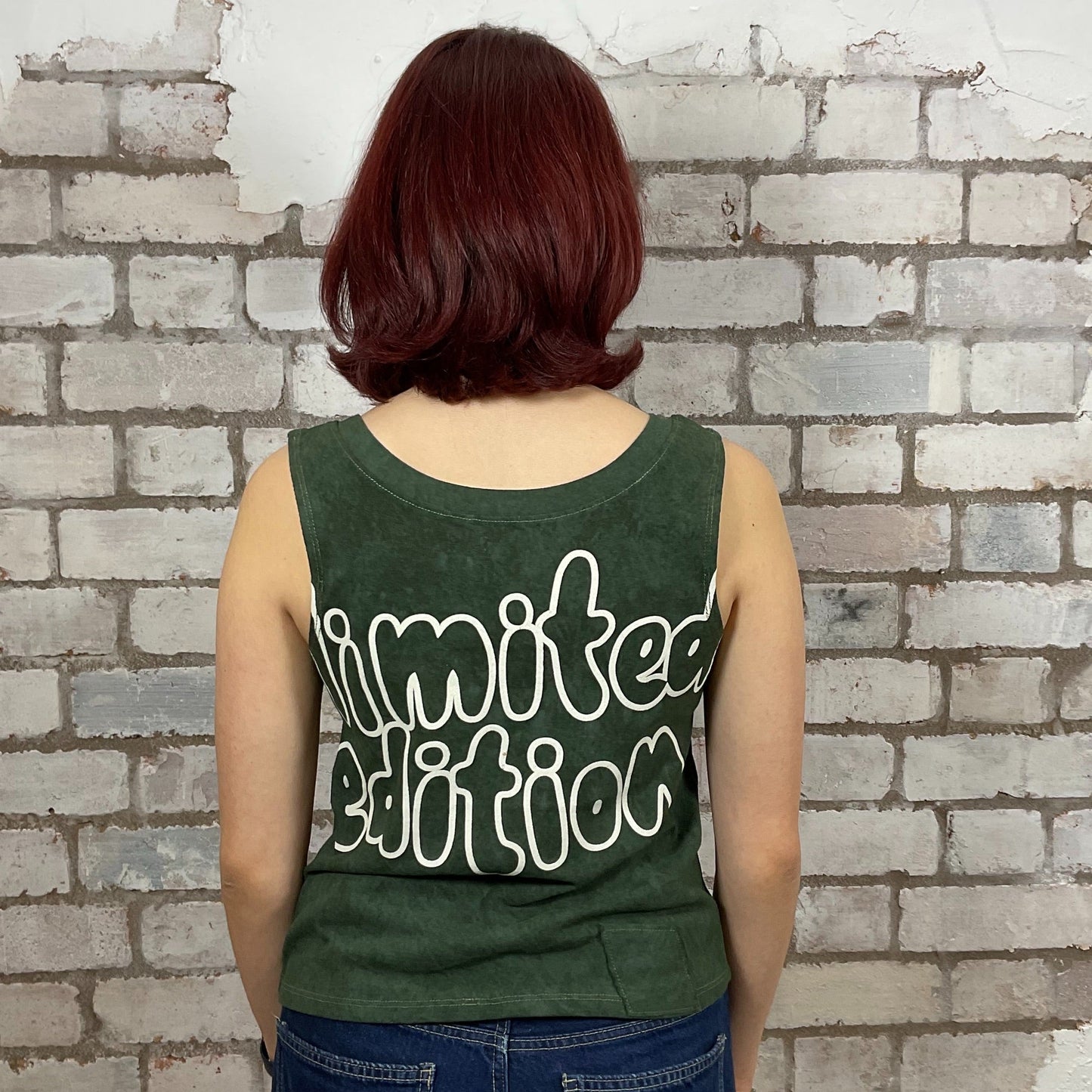 Limited Edition Reverse Graphic print on 100% Forest Green cotton fabric, Unwantee made from upcycled and deconstructed graphic tshirt, punk rock style street wear, athleisure wear, unwantees is a sustainable fashion brand, we take unwanted graphic tshirts otherwise destined for landfill and recycle clothing into vest tops for sports wear or leisure.  Refashioned band merch, Slash Neck Sleeveless Top