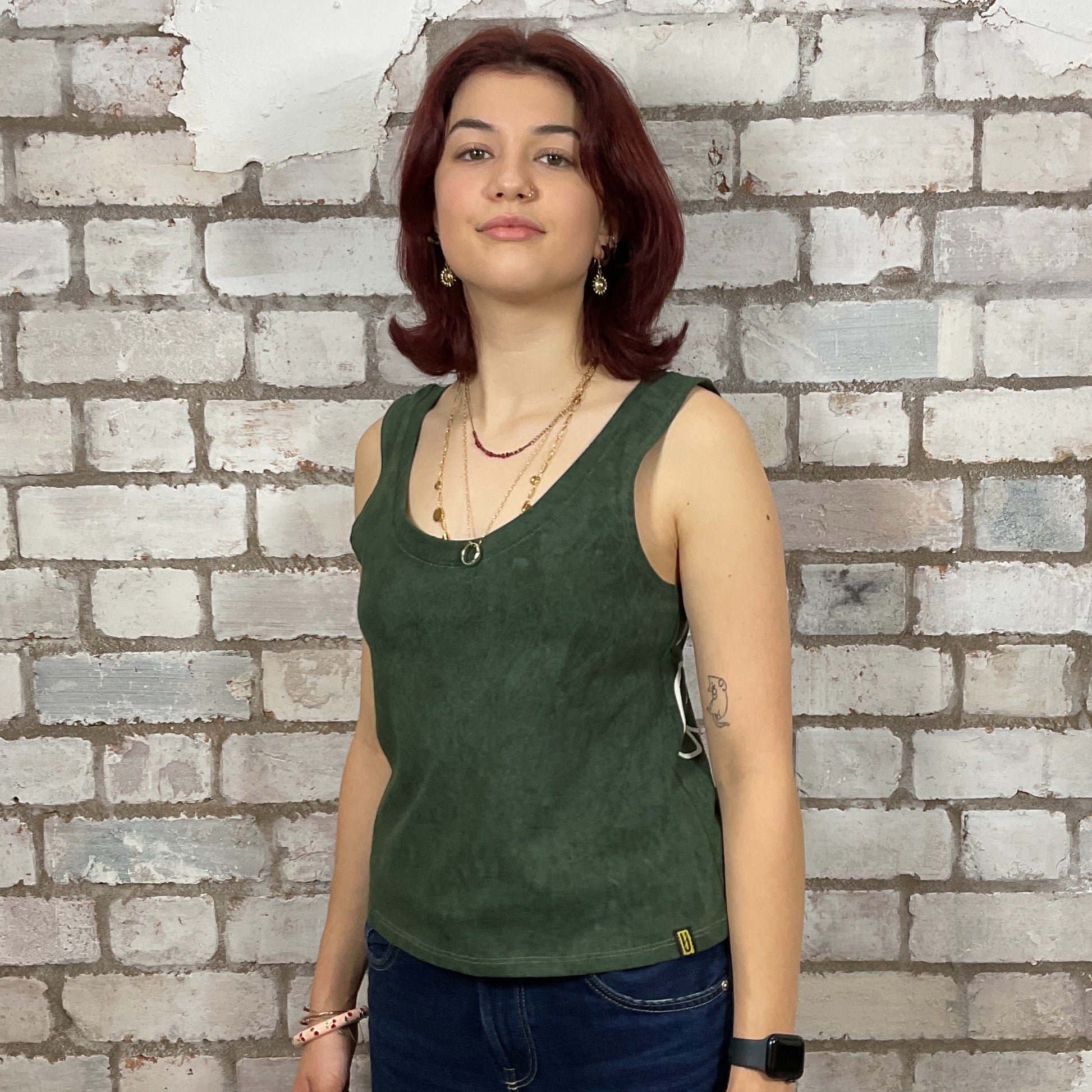 Limited Edition Reverse Graphic print on 100% Green cotton fabric, Unwantee made from upcycled and deconstructed graphic tshirt, punk rock style street wear, athleisure wear, unwantees is a sustainable fashion brand, we take unwanted graphic tshirts otherwise destined for landfill and recycle clothing into vest tops for sports wear or leisure.  Refashioned band merch, Slash Neck Sleeveless Top