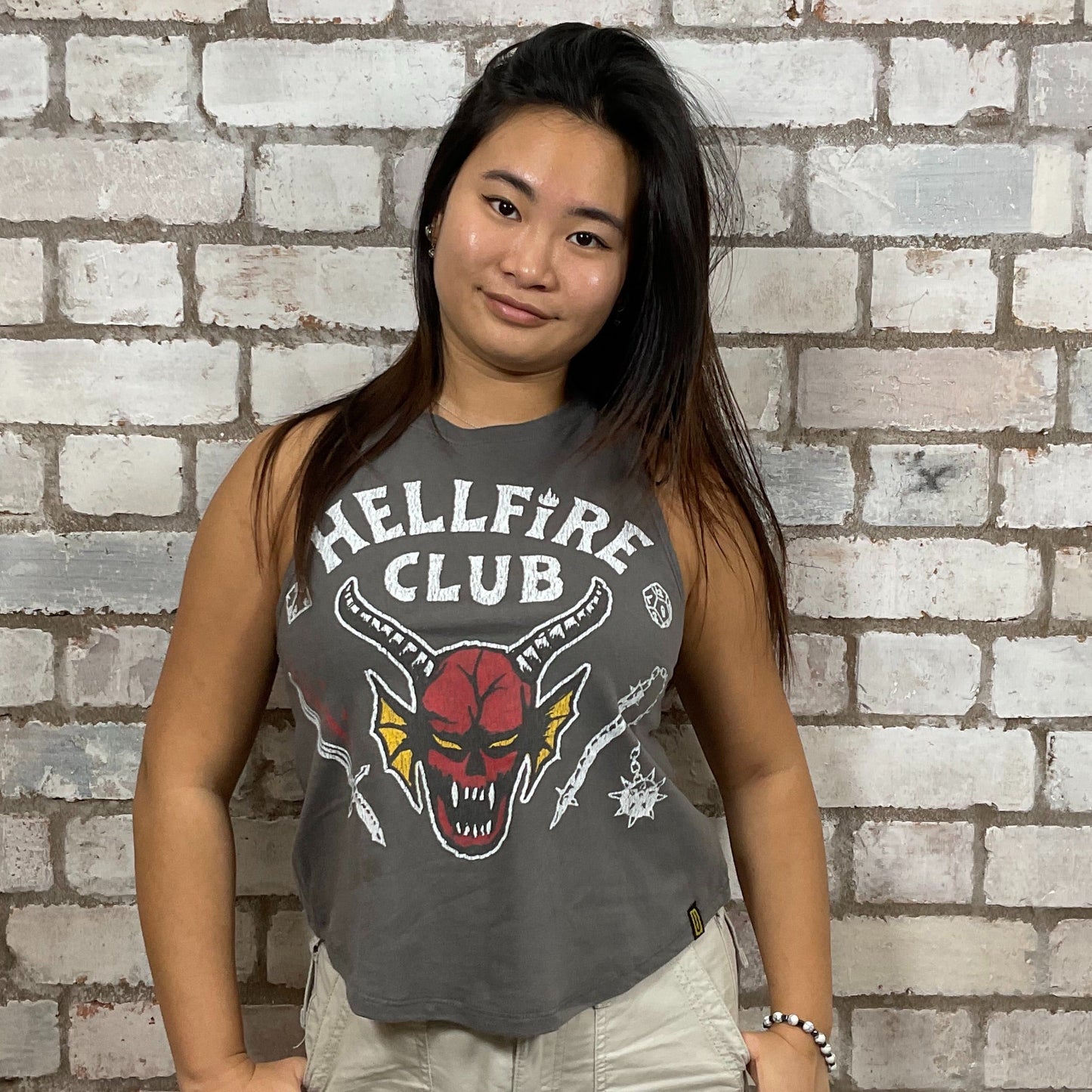 Become a member of the Hellfire club from Stranger Things Graphic print on 100% black cotton fabric, Festival Style Unwantee made from upcycled and deconstructed graphic tshirt, punk rock style street wear, athleisure wear, unwantees is a sustainable fashion brand, we take unwanted graphic tshirts otherwise destined for landfill and recycle clothing into vest tops for sports wear or leisure.  Refashioned band merch, Slash Neck Sleeveless Top