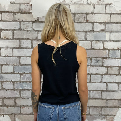 The Foo Fighters Learn to Fly graphic tshirt recycled into sleeveless vest top, sustainable upcycled fashion, British recycled fashion brand, slow fashion, eco conscious band graphic tshirt upcycled by Unwantees, recycled tshirt otherwise destined for landfill.  Rock music style graphic tshirt upcycled by Unwantees, Slash Neck tank top, upcycled in the UK by unwantees. Sustainable upcycled fashion