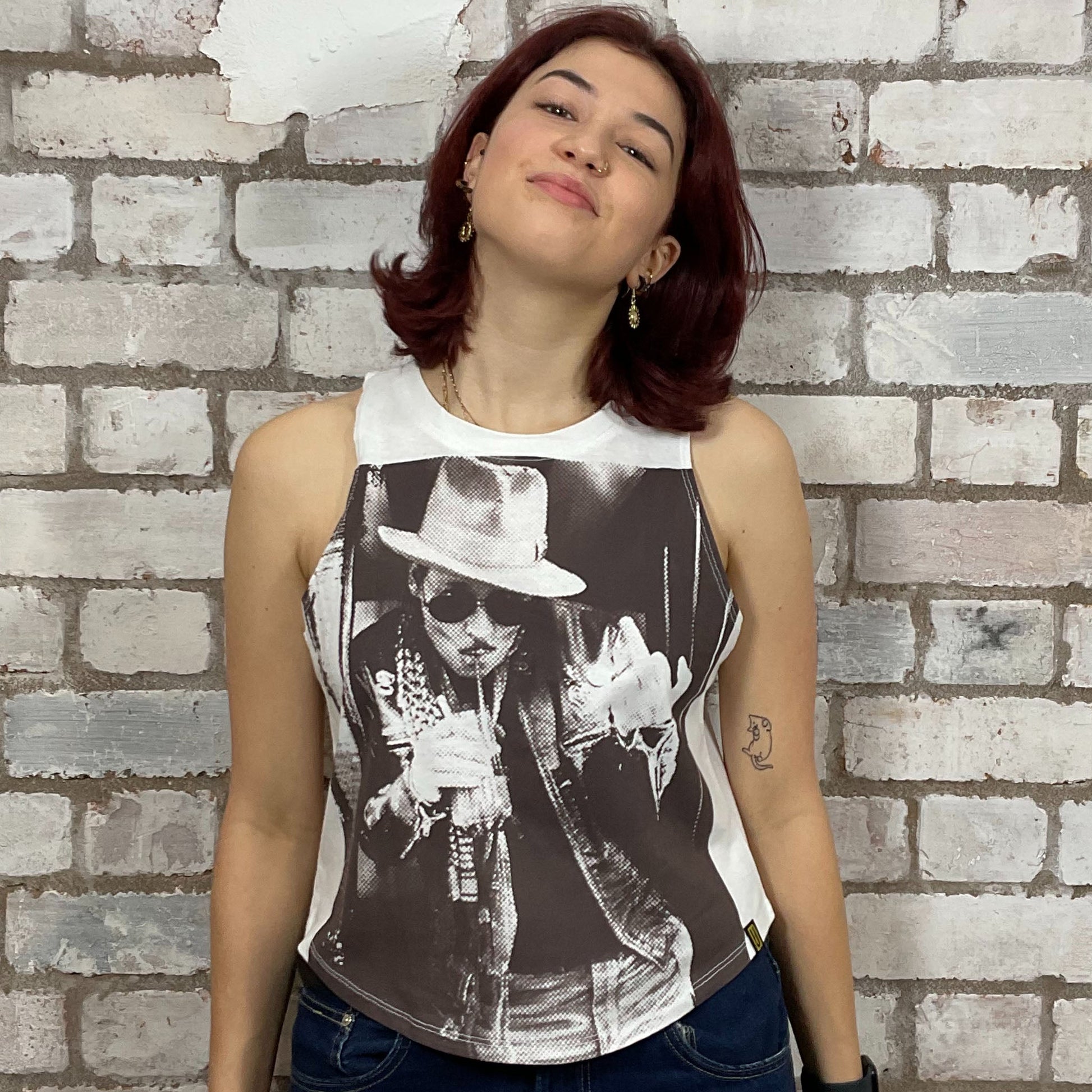 The sexy Johnny Depp Graphic print on 100% white cotton fabric, Festival Style Unwantee made from upcycled and deconstructed graphic tshirt, punk rock style street wear, athleisure wear, unwantees is a sustainable fashion brand, we take unwanted graphic tshirts otherwise destined for landfill and recycle clothing into vest tops for sports wear or leisure.  Refashioned band merch, Slash Neck Sleeveless Top