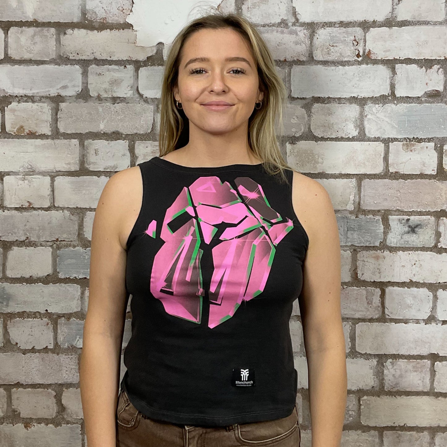 Hackney Diamonds, Rolling Stones, Graphic print on 100% black cotton fabric, Festival Style Unwantee made from upcycled and deconstructed graphic tshirt, punk rock style street wear, athleisure wear, unwantees is a sustainable fashion brand, we take unwanted graphic tshirts otherwise destined for landfill and recycle clothing into vest tops for sports wear or leisure.  Refashioned band merch, Slash Neck Sleeveless Top