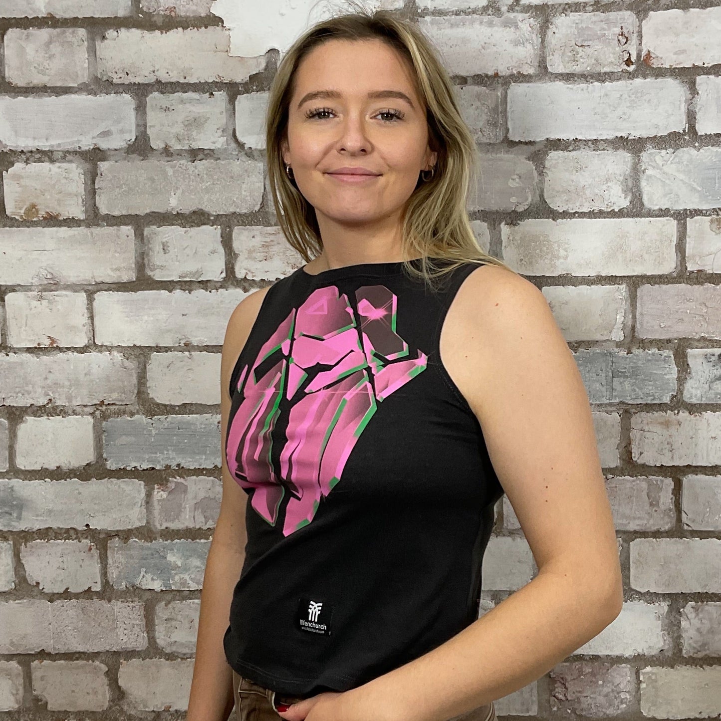 Hackney Diamonds, Rolling Stones, electric pink Graphic print on 100% black cotton fabric, Festival Style Unwantee made from upcycled and deconstructed graphic tshirt, punk rock style street wear, athleisure wear, unwantees is a sustainable fashion brand, we take unwanted graphic tshirts otherwise destined for landfill and recycle clothing into vest tops for sports wear or leisure.  Refashioned band merch, Slash Neck Sleeveless Top
