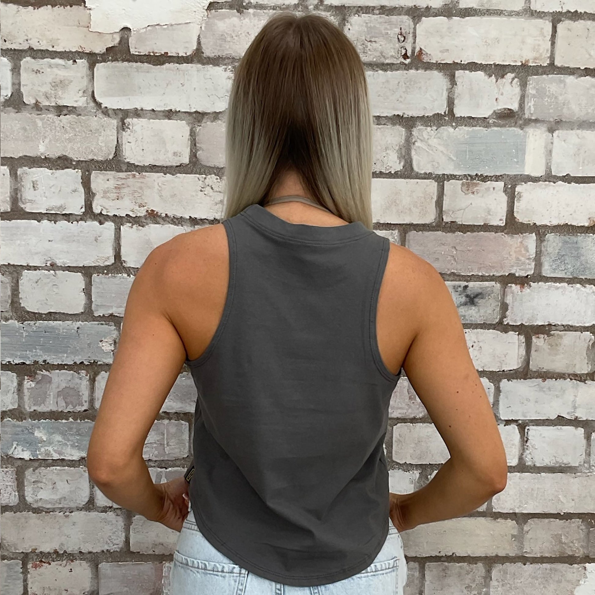 Savage graphic print tshirt recycled into sleeveless vest top, sustainable upcycled fashion, British recycled fashion brand, slow fashion, eco conscious band graphic tshirt upcycled by Unwantees, recycled tshirt otherwise destined for landfill.  Rock music style graphic tshirt upcycled by Unwantees, Grey Racerback tank top, upcycled in the UK by unwantees. Sustainable upcycled fashion