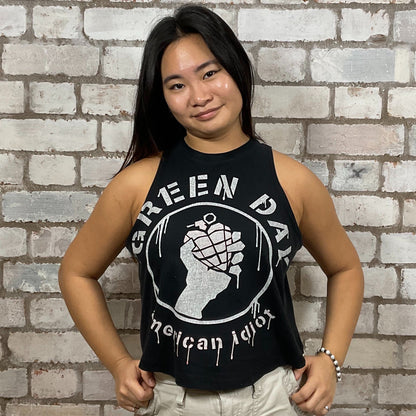 Green Day’s American Idiot Album Graphic print on 100% black cotton fabric, Festival Style Unwantee made from upcycled and deconstructed graphic tshirt, punk rock style street wear, athleisure wear, unwantees is a sustainable fashion brand, we take unwanted graphic tshirts otherwise destined for landfill and recycle clothing into vest tops for sports wear or leisure.  Refashioned band merch, Slash Neck Sleeveless Top