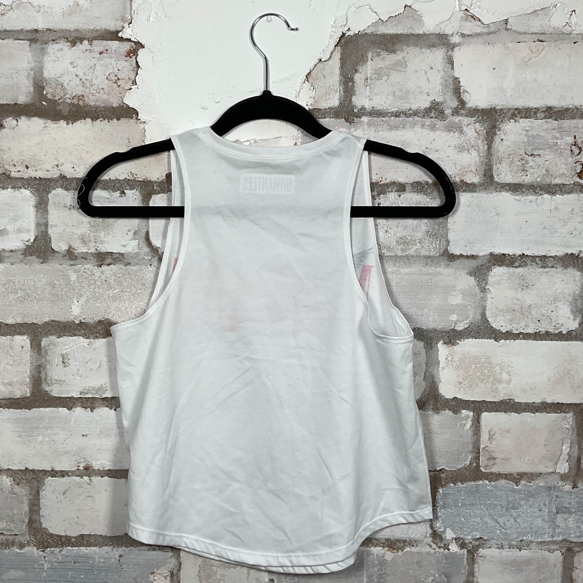 Rear View of Nirvana classic logo in hot pink on a white Racerback Vest Top upcycled by Unwantees, sustainable fashion made in Great Britain from vintage graphic tshirt 