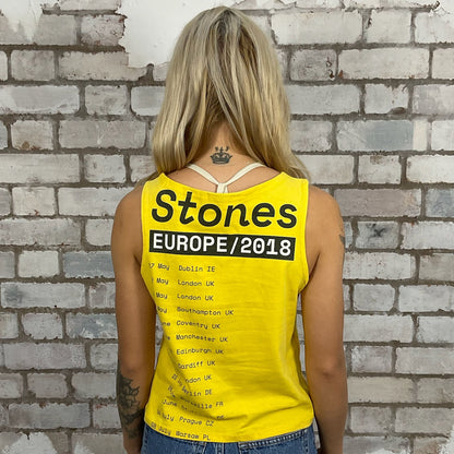 The Rolling Stones 2018 European Tour Print Slash neck tank top made from an upcycled yellow graphic band tshirt, punk rock style street wear, athleisure wear, unwantees is a sustainable fashion brand, we take unwanted graphic tshirts otherwise destined for landfill and recycle clothing into vest tops for sports wear or leisure.  Refashioned band merch, Slash Neck Sleeveless Top