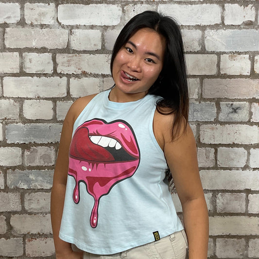 Lips Hot Pink Graphic on baby blue Tshirt Upcycled by Unwantees, colourful Graphics on jersey fabric, Festival Style Unwantee made from upcycled and deconstructed graphic tshirt, athleisure wear, unwantees is a sustainable fashion brand, we take unwanted graphic tshirts otherwise destined for landfill and recycle clothing into vest tops for sports wear or leisure.  Refashioned band merch, Slash Neck Sleeveless Top