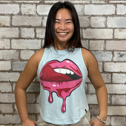 Licking lips Hot Pink Graphic on baby blue Tshirt Upcycled by Unwantees, colourful Graphics on khaki green jersey fabric, Festival Style Unwantee made from upcycled and deconstructed graphic tshirt, athleisure wear, unwantees is a sustainable fashion brand, we take unwanted graphic tshirts otherwise destined for landfill and recycle clothing into vest tops for sports wear or leisure.  Refashioned band merch, Slash Neck Sleeveless Top