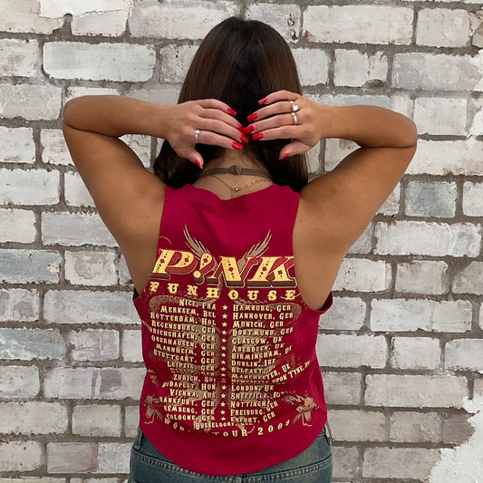 Upcycled pink tour band tshirt now a tank top, upcycled in the UK by unwantees. Sustainable fashion brand Unwantees recycled band tshirts otherwise destined for landfill.  Sustainable upcycled fashion, punk and rock Music Style, sleeveless tank top, sustainable upcycled fashion, British recycled fashion brand