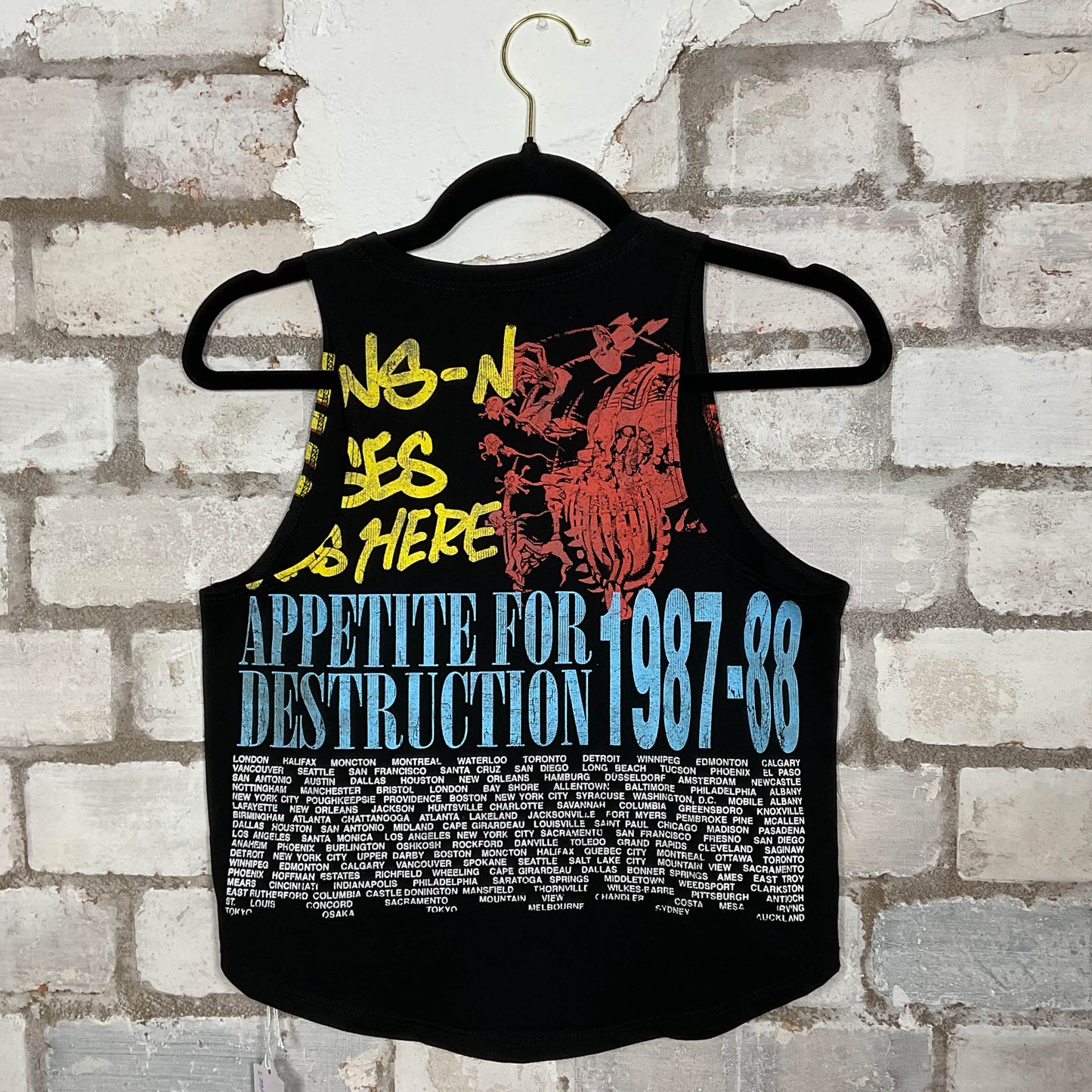 Rear view of Double Sided GNR Guns’N’Roses 1987/88 Tour Vintage Tshirt merch graphics on black cotton Racerback Tank Top upcycled by Unwantees, sustainable fashion made in Great Britain from vintage graphic tshirt