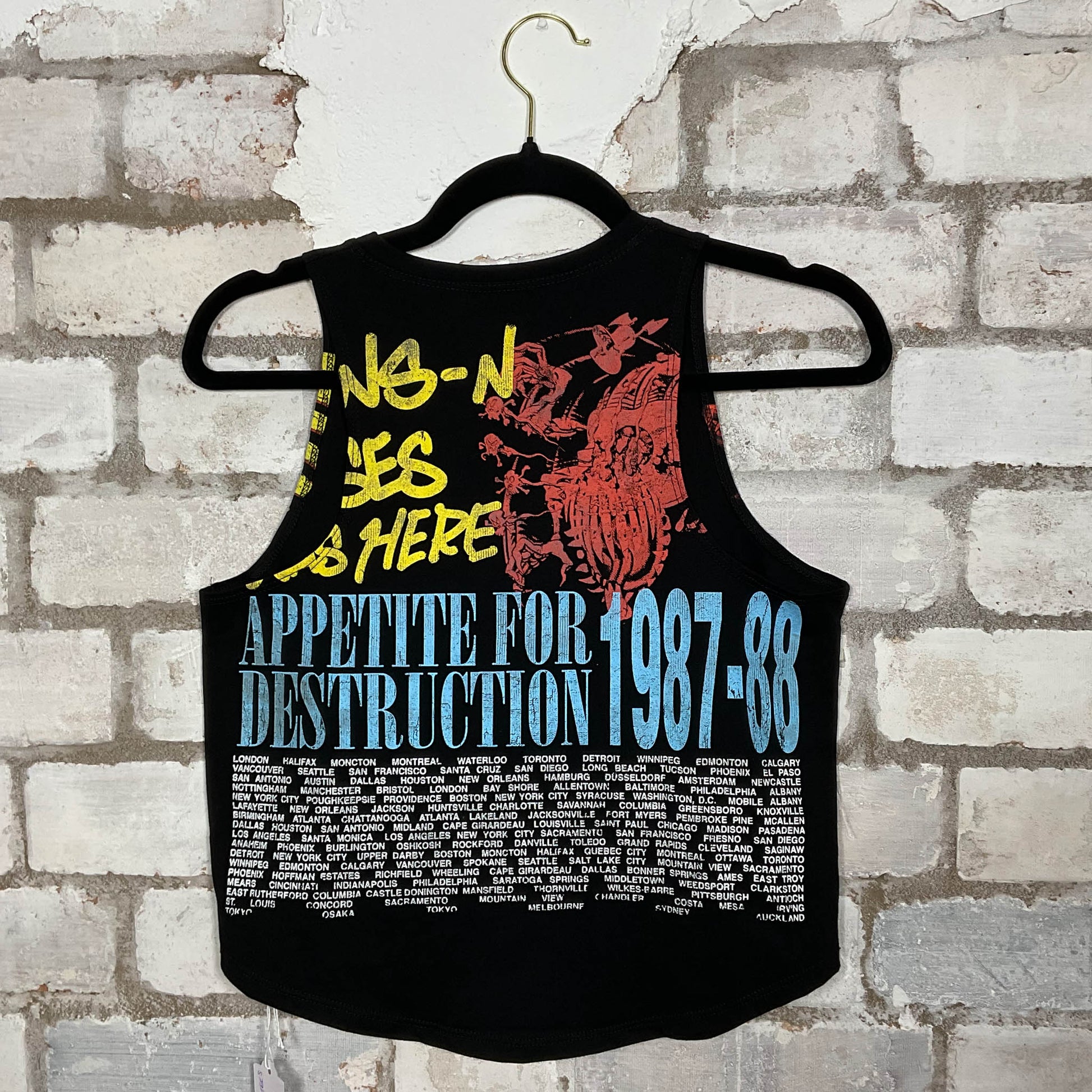 Rear view of Double Sided GNR Guns’N’Roses 1987/88 Tour Vintage Tshirt merch graphics on black cotton Racerback Tank Top upcycled by Unwantees, sustainable fashion made in Great Britain from vintage graphic tshirt