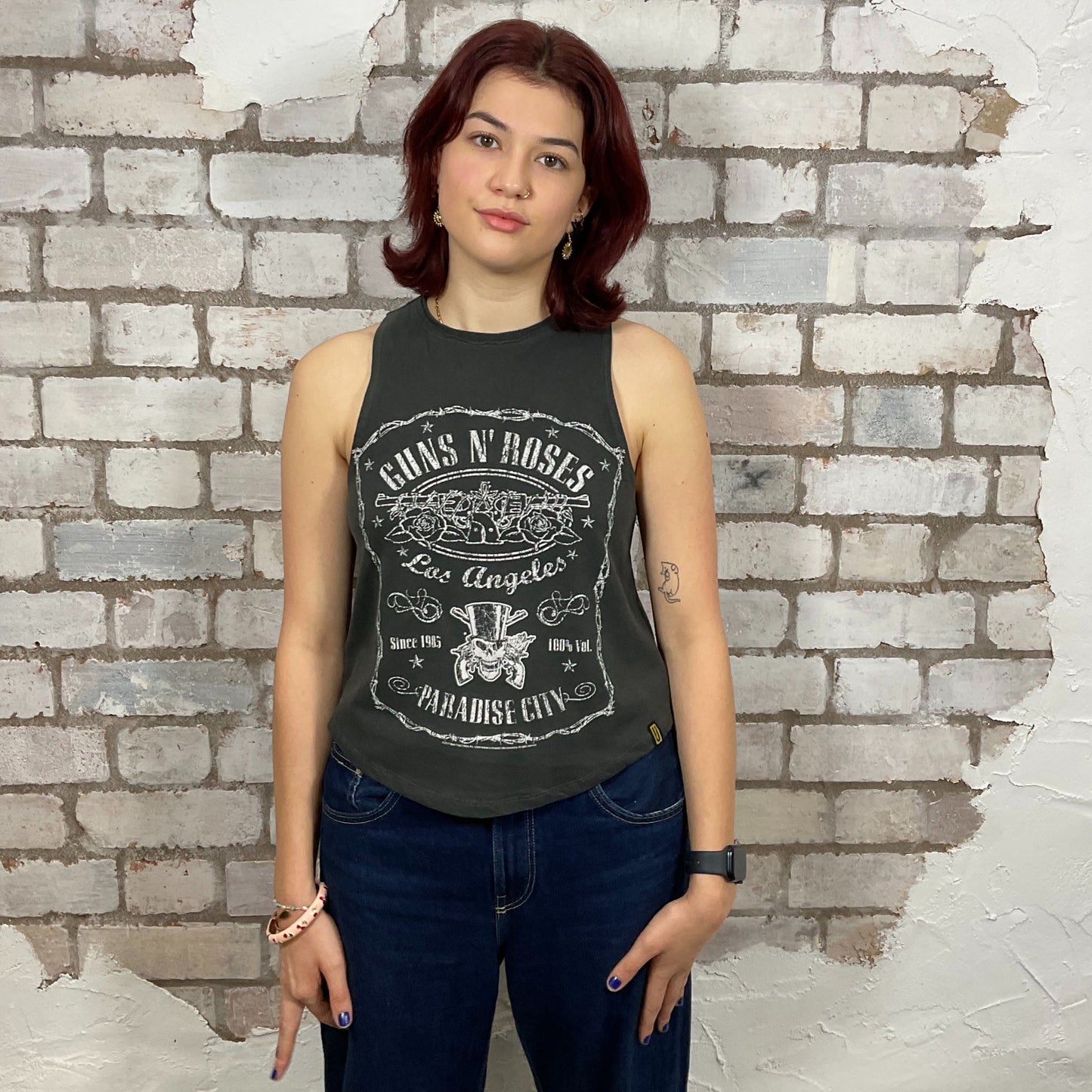 Guns’N’Roses Paradise City band merchandise n the style of Tennessee Whisky,  made from upcycled and deconstructed graphic tshirt, punk rock style street wear, athleisure wear, unwantees is a sustainable fashion brand, we take unwanted graphic tshirts otherwise destined for landfill and recycle clothing into vest tops for sports wear or leisure.  Refashioned band merch, Slash Neck Sleeveless Top