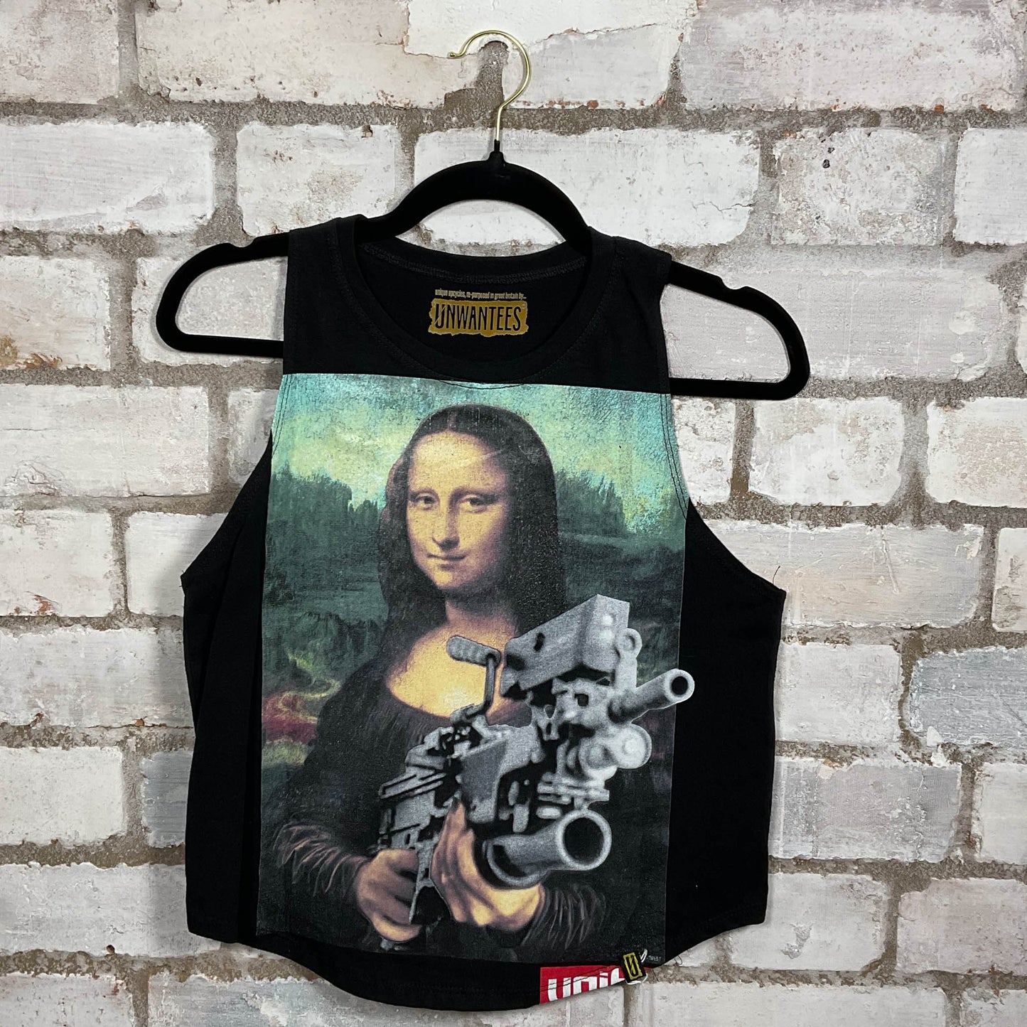 Machine gun toting Mona Lisa Illustration graphic on black cotton Racerback Tank Top upcycled by Unwantees, sustainable fashion made in Great Britain from vintage graphic tshirt 