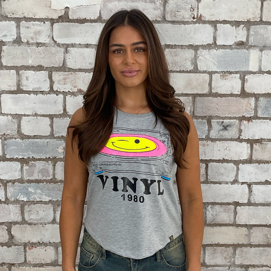 1980s themed graphic tshirt upcycled by Unwantees,  eco conscious fashion graphic tshirt upcycled by Unwantees, recycled tshirt otherwise destined for landfill.  Graphic tshirt recycled into sleeveless vest top, sustainable upcycled fashion, British recycled acid house print slow fashion, Punk Rock music style graphic tshirt upcycled by Unwantees, Racerback tank top, upcycled in the UK by unwantees. Sustainable upcycled fashion
