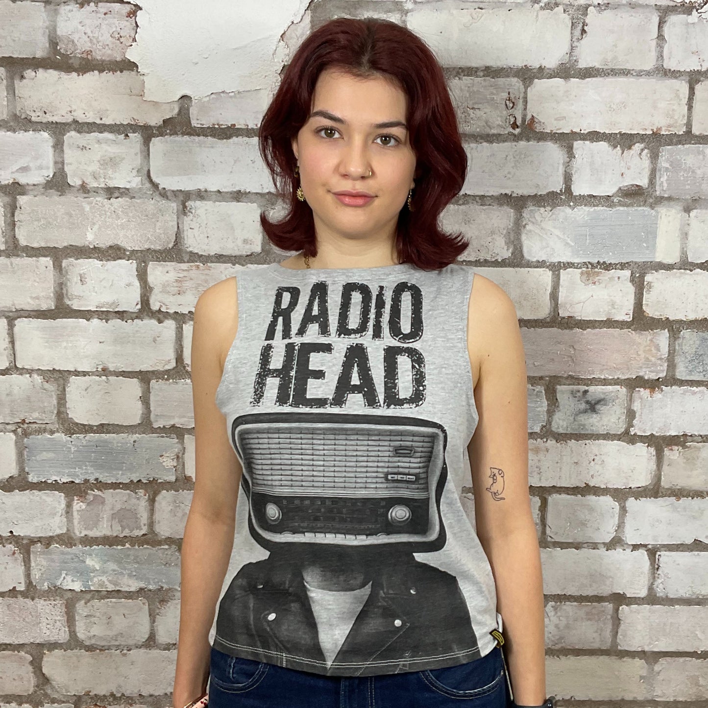 Radiohead classic band logo graphic print ion 100% cotton fabric, black on grey, Unwantee made from upcycled and deconstructed graphic tshirt, punk rock style street wear, athleisure wear, unwantees is a sustainable fashion brand, we take unwanted graphic tshirts otherwise destined for landfill and recycle clothing into vest tops for sports wear or leisure.  Refashioned band merch, Slash Neck Sleeveless Top