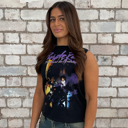 Woman wearing a Prince sleeveless graphic t-shirt in front of a brick wall. one-of-a-kind clothing
unique tank tops / unique vests
handmade clothing UK
reworked t-shirts UK
limited edition fashion
sustainable streetwear
sustainable tank tops
women’s eco fashion UK

