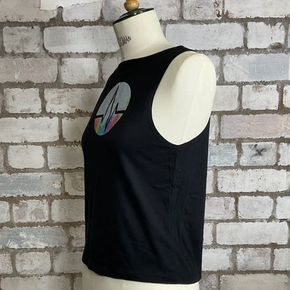 Black tank top with a graphic design on a mannequin against a brick wall. Graphic tshirt up cycle project by Unwantees, Shock wave, heart beat, rhythm, pulse, beat, wave tank top, vest top, Unwantee 