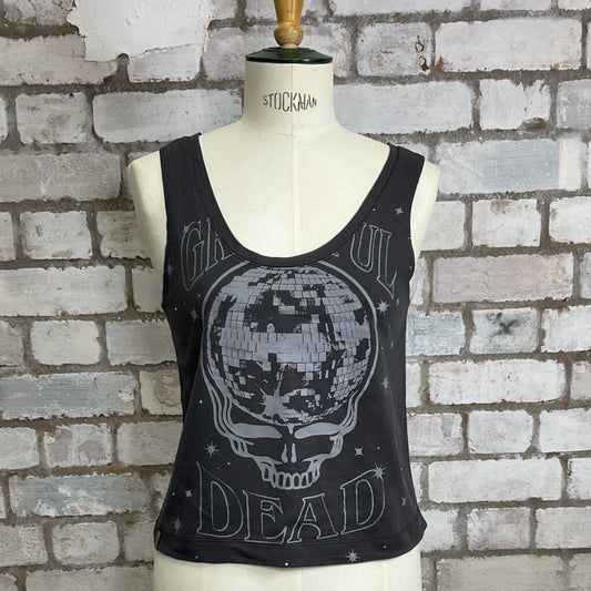 Black tank top with skull design on a mannequin against a brick wall.  Grateful Dead Tank top. Vest Top, Faded Grey Tank, sleeveless top