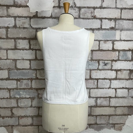 White sleeveless top on a mannequin against a textured brick wall.  Unwantees Slash Neck Style, High Neck, Crew Neck Tank Top