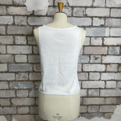 White sleeveless top on a mannequin against a textured brick wall.  Unwantees Slash Neck Style, High Neck, Crew Neck Tank Top