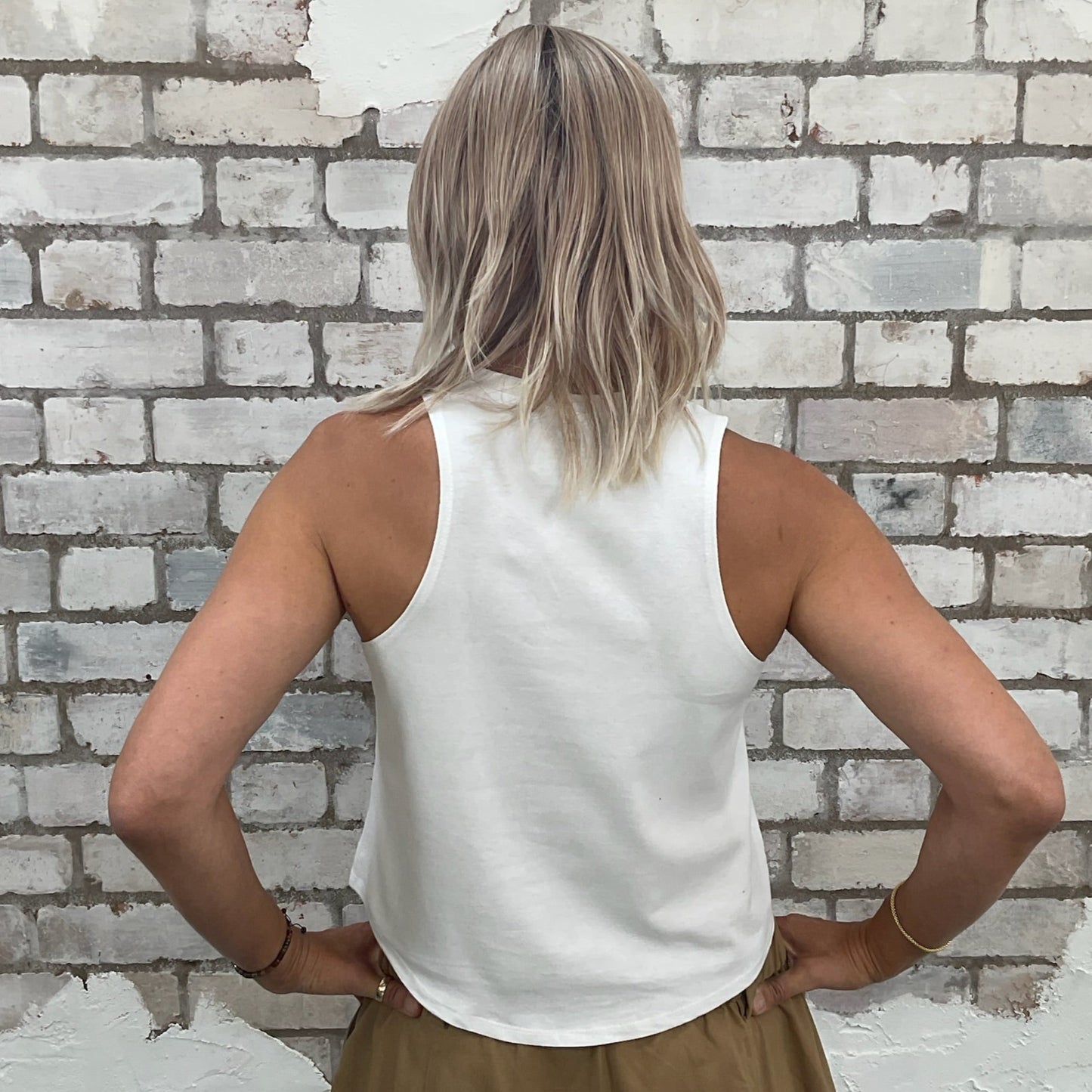 One-of-a-kind Comme des Garçons graphic Racerback Unwantee tank top back view, upcycled, sustainable, made in Britain